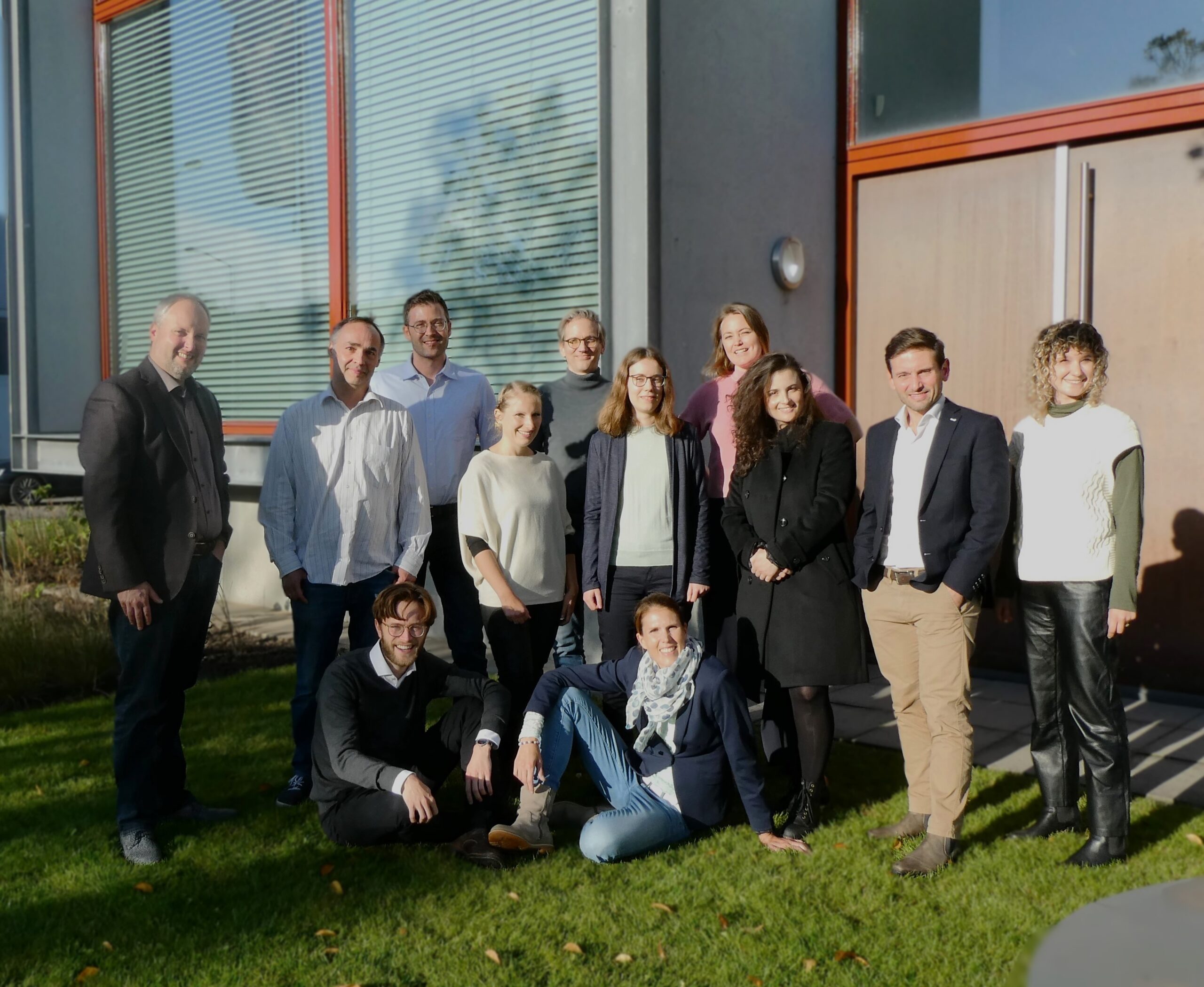 Group of people posing for a team picture.